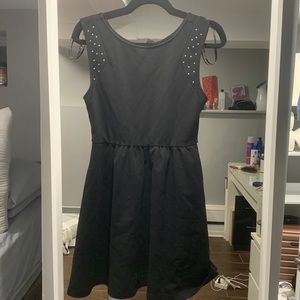 Studded arm less Black dress a symmetrical short black dress medium